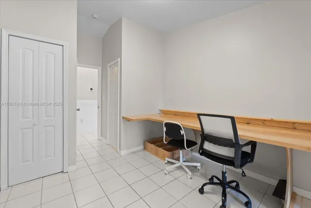 a workspace with furniture and bathroom