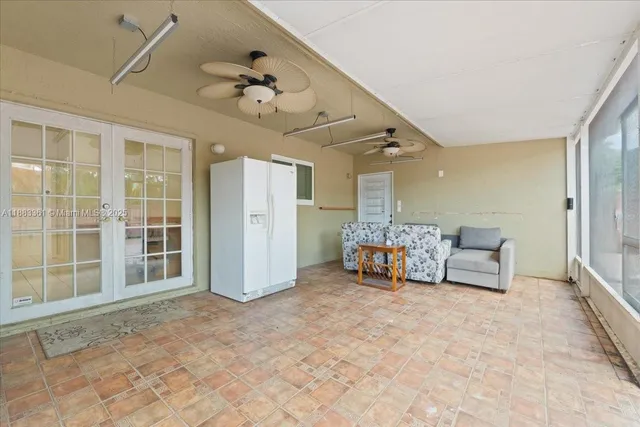 an entryway and livingroom with furniture