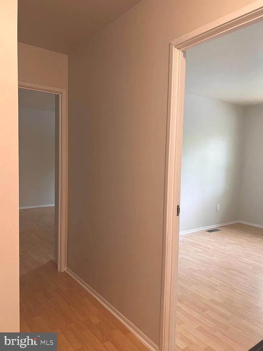 207 Village Walk, Unit 207 Exton, PA 19341 - Photo 12 of 17 Bright and inviting hallway with open doors.