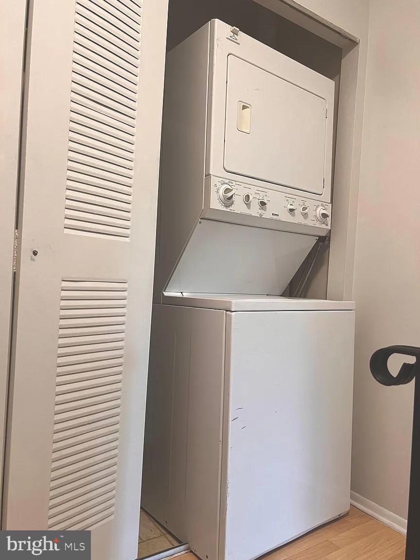 207 Village Walk, Unit 207 Exton, PA 19341 - Photo 14 of 17 Compact laundry solution in a cozy nook.