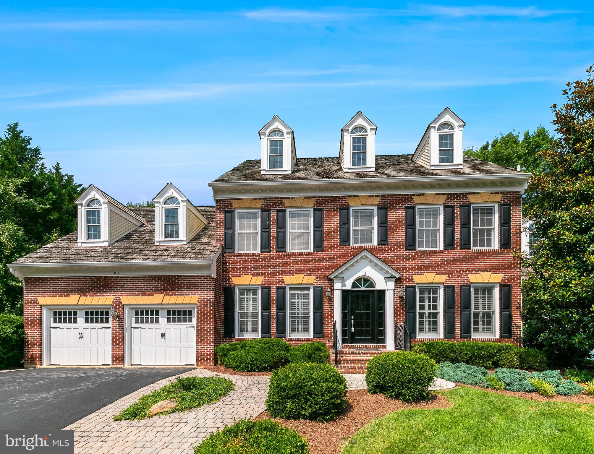 611 Catesby Court Southwest Leesburg, VA 20175 - Photo 1 of 96 a front view of a house with garden