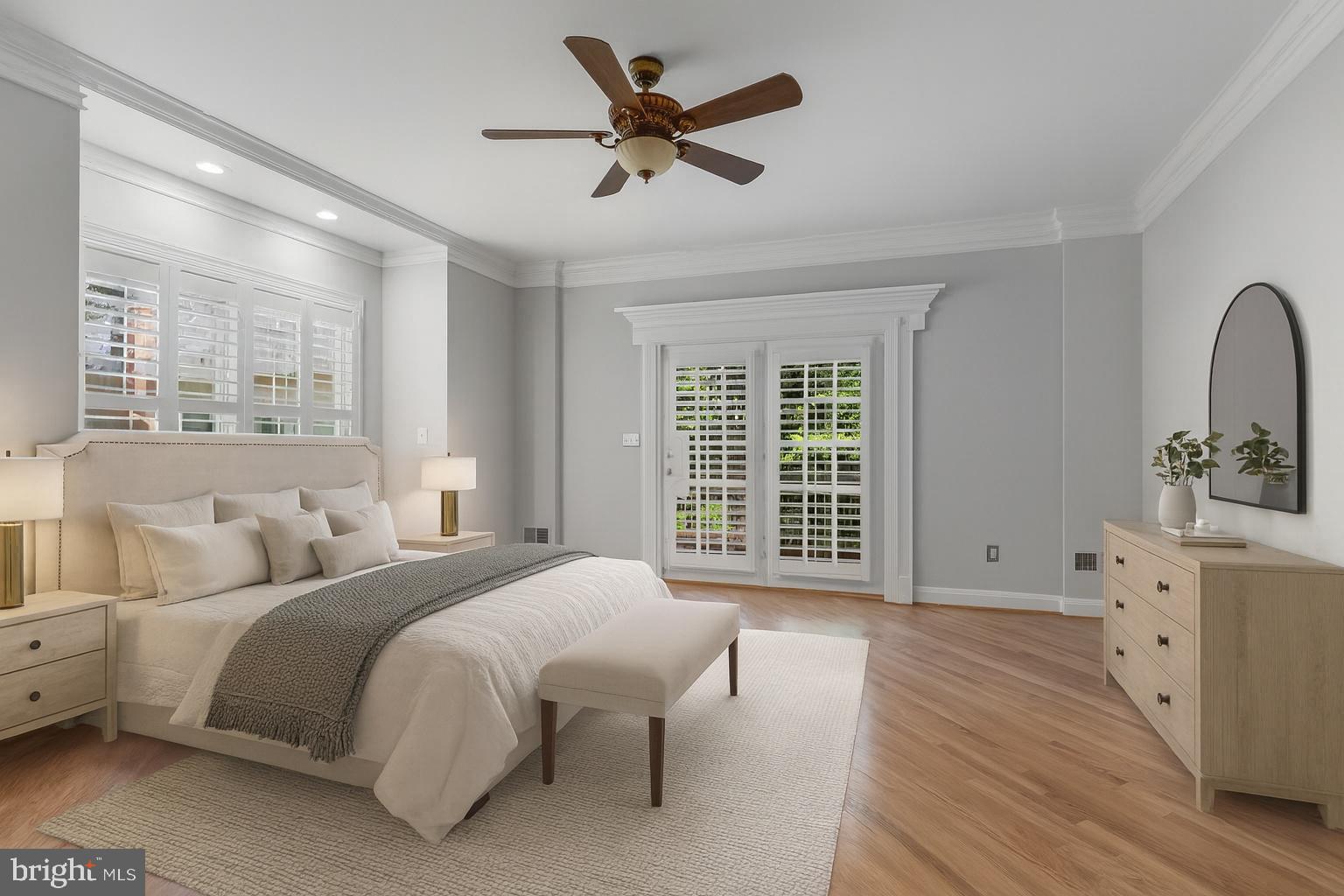 611 Catesby Court Southwest Leesburg, VA 20175 - Photo 16 of 96 a spacious bedroom with a bed a chandelier and large window