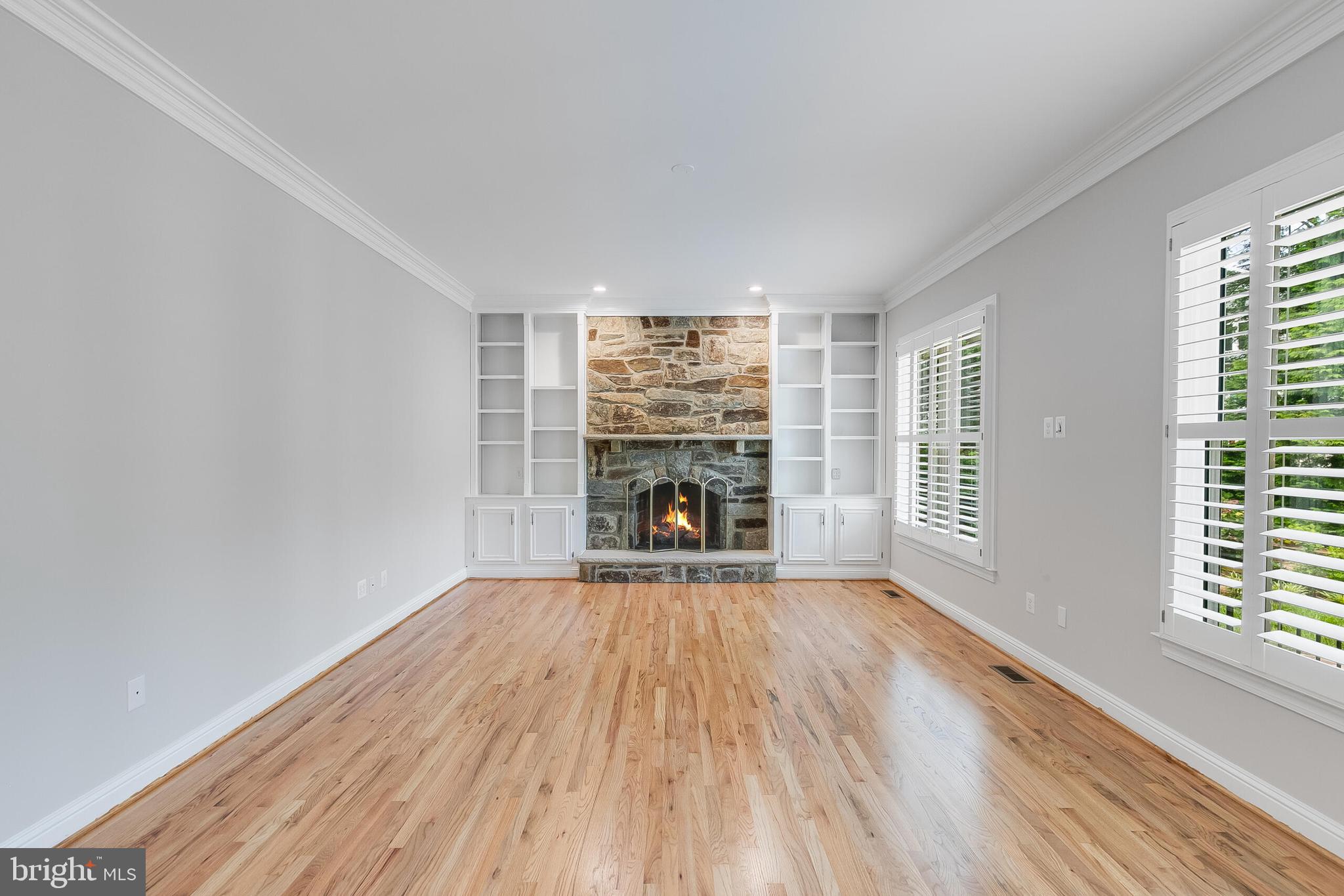 611 Catesby Court Southwest Leesburg, VA 20175 - Photo 24 of 96 a view of empty room with wooden floor and fireplace