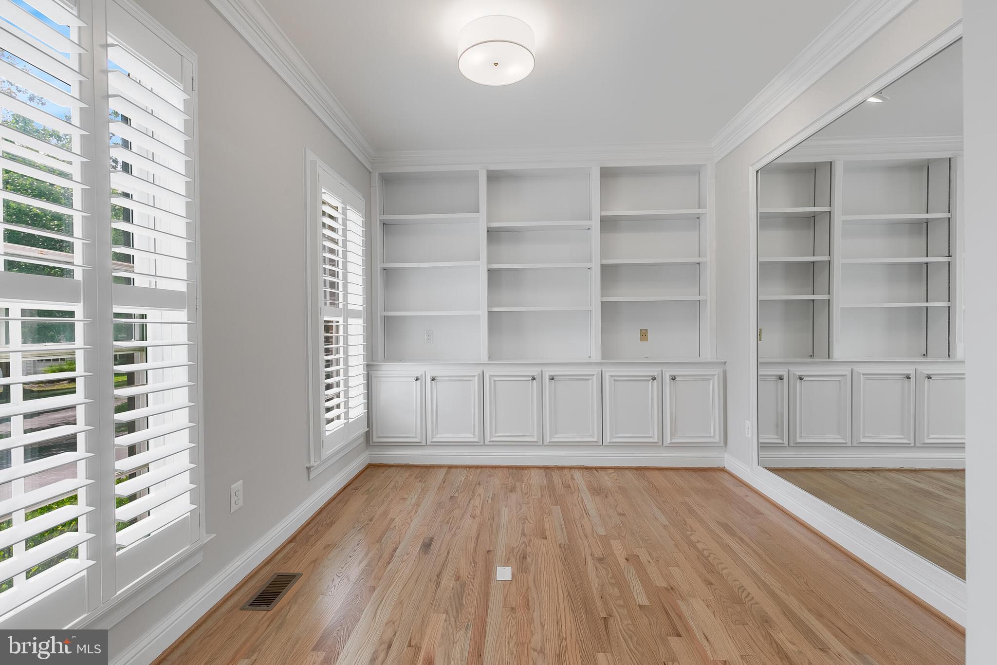 611 Catesby Court Southwest Leesburg, VA 20175 - Photo 26 of 96 a view of an empty room with a window and wooden floor