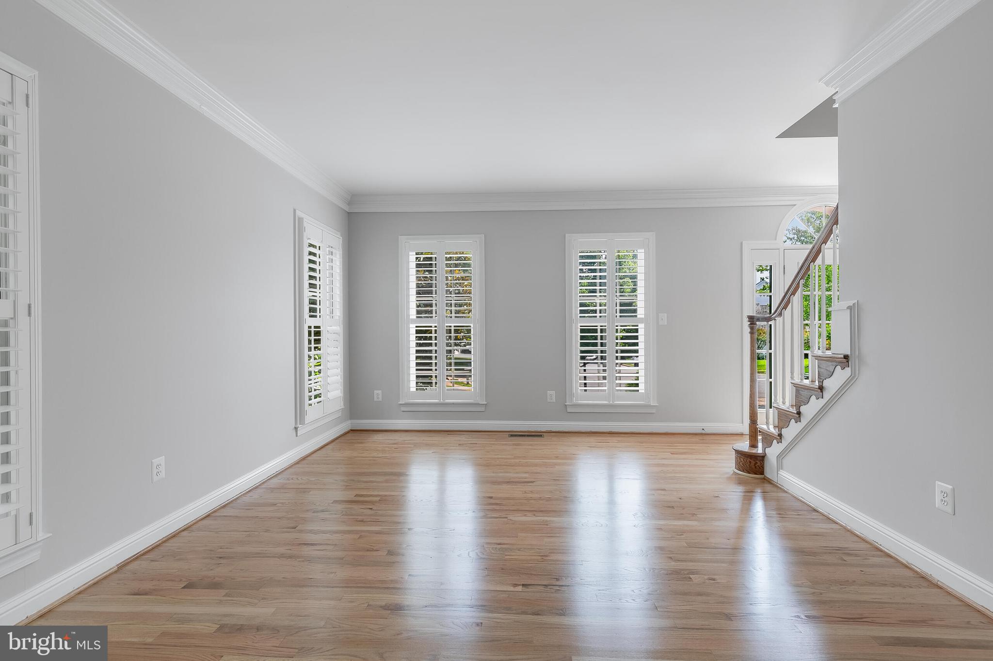 611 Catesby Court Southwest Leesburg, VA 20175 - Photo 27 of 96 a view of an empty room with wooden floor and a window