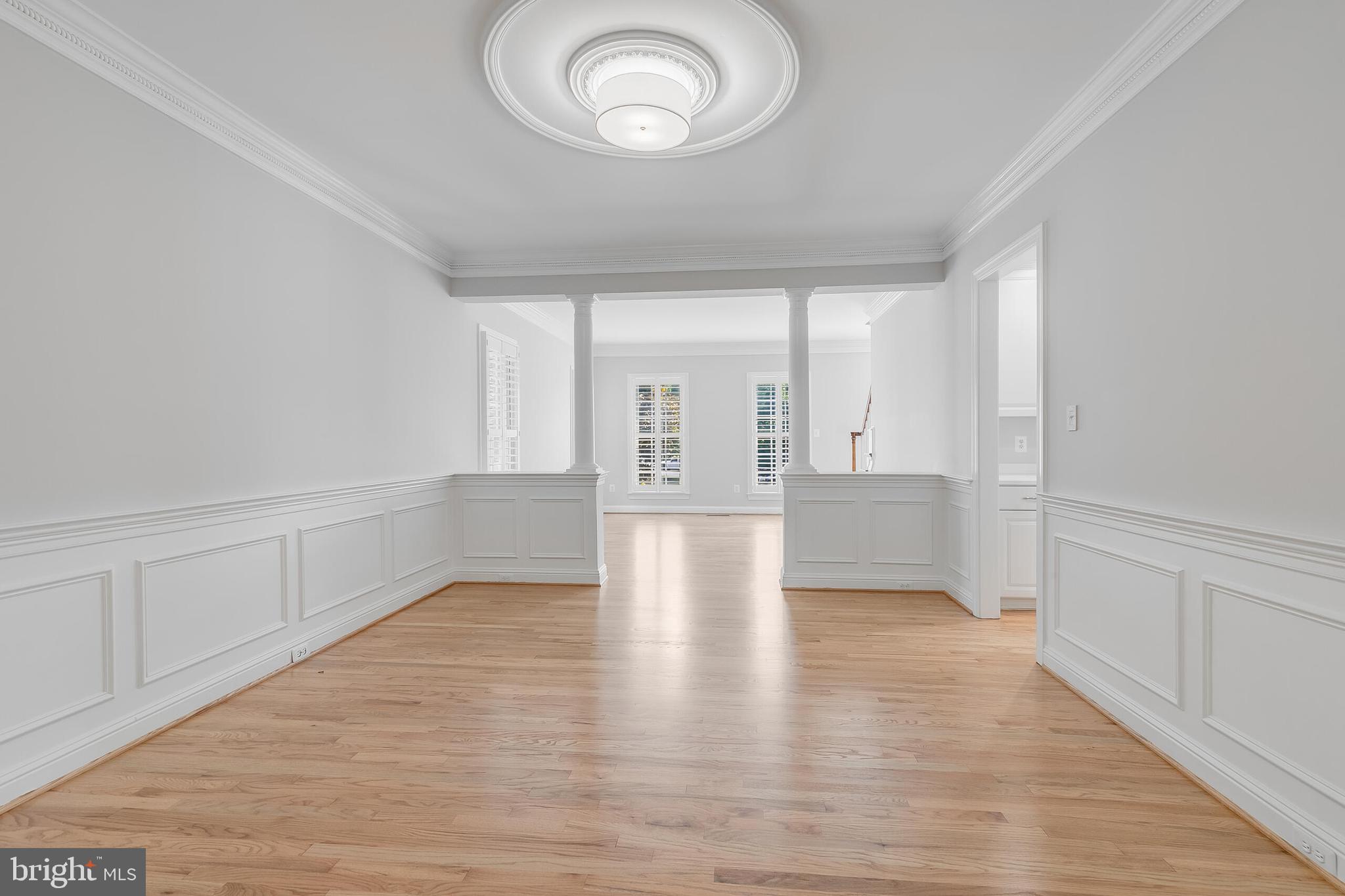 611 Catesby Court Southwest Leesburg, VA 20175 - Photo 29 of 96 a view of an empty room with wooden floor and a window