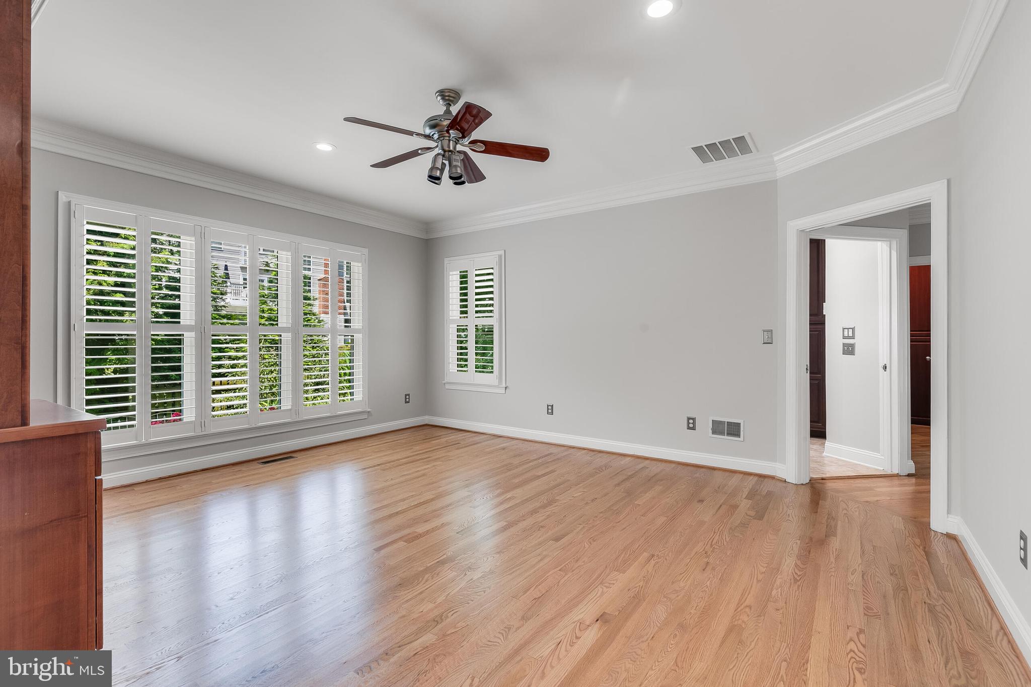 611 Catesby Court Southwest Leesburg, VA 20175 - Photo 34 of 96 a view of an empty room with wooden floor and a window