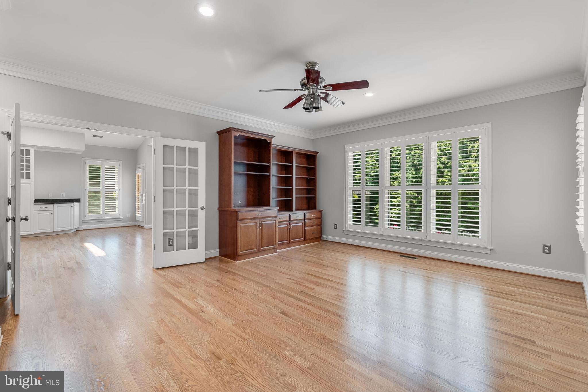 611 Catesby Court Southwest Leesburg, VA 20175 - Photo 35 of 96 a view of empty room with wooden floor and fan