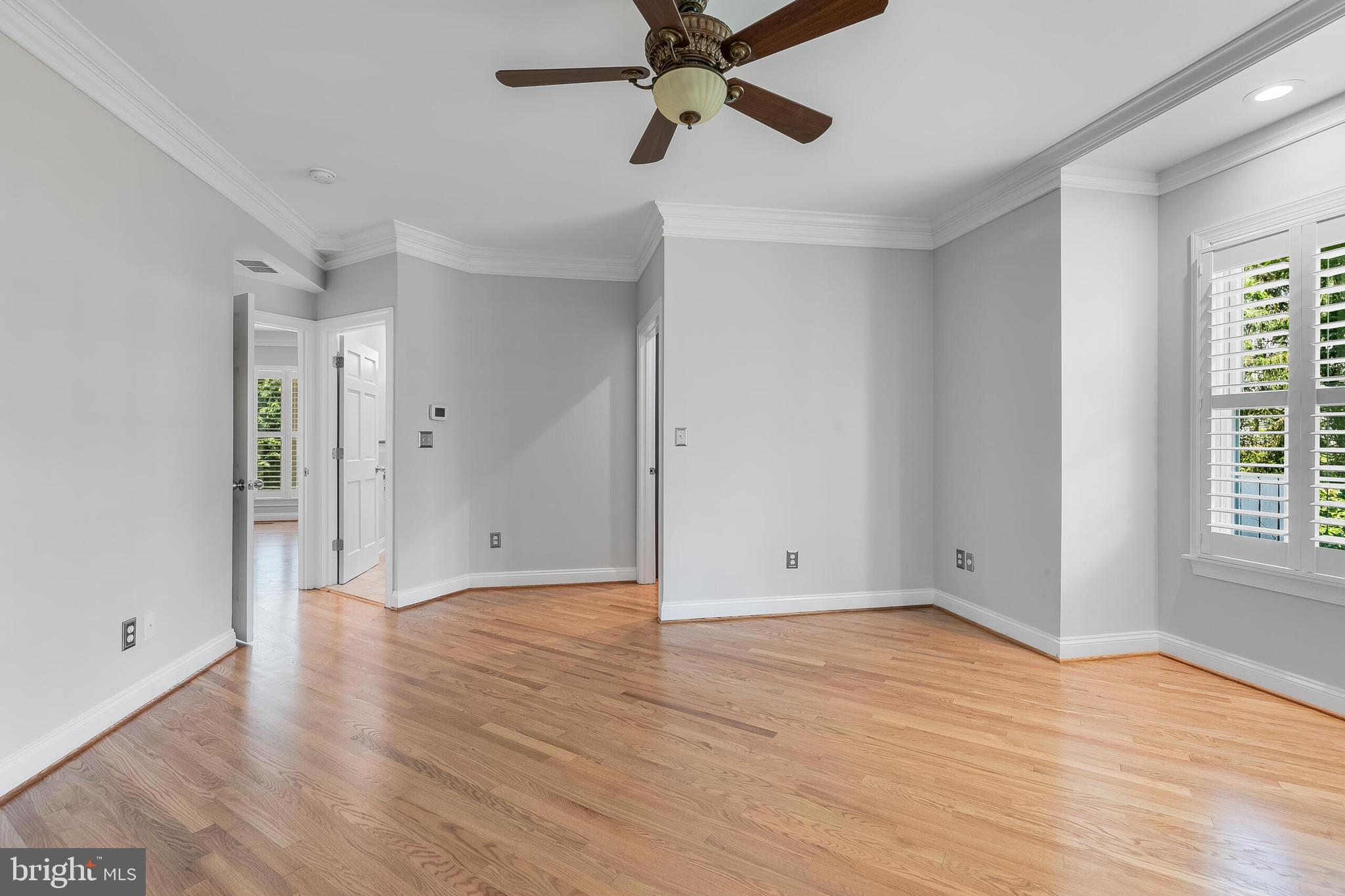 611 Catesby Court Southwest Leesburg, VA 20175 - Photo 41 of 96 a view of an empty room with wooden floor and a window