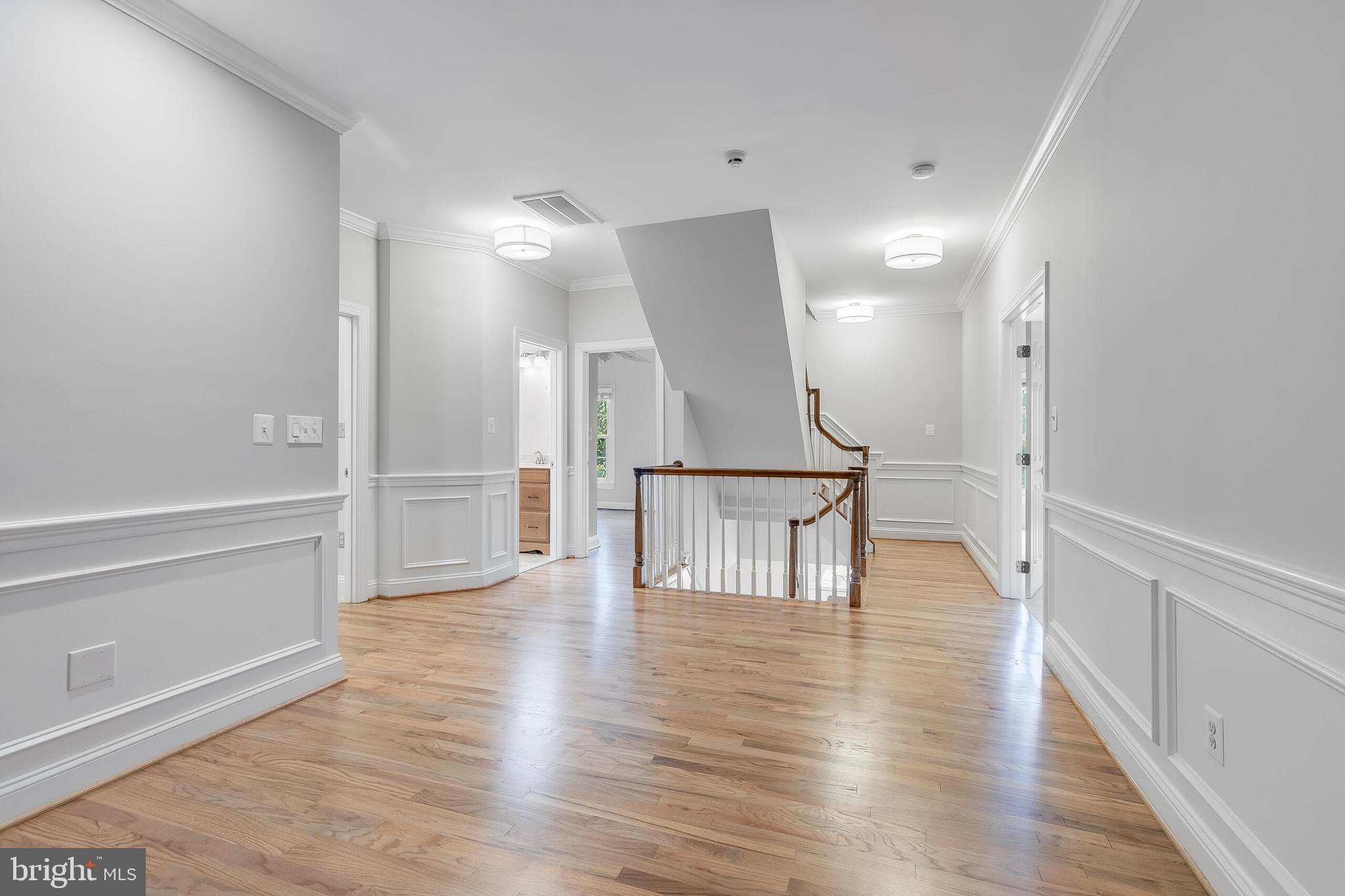 611 Catesby Court Southwest Leesburg, VA 20175 - Photo 47 of 96 a view of a hallway with wooden floor