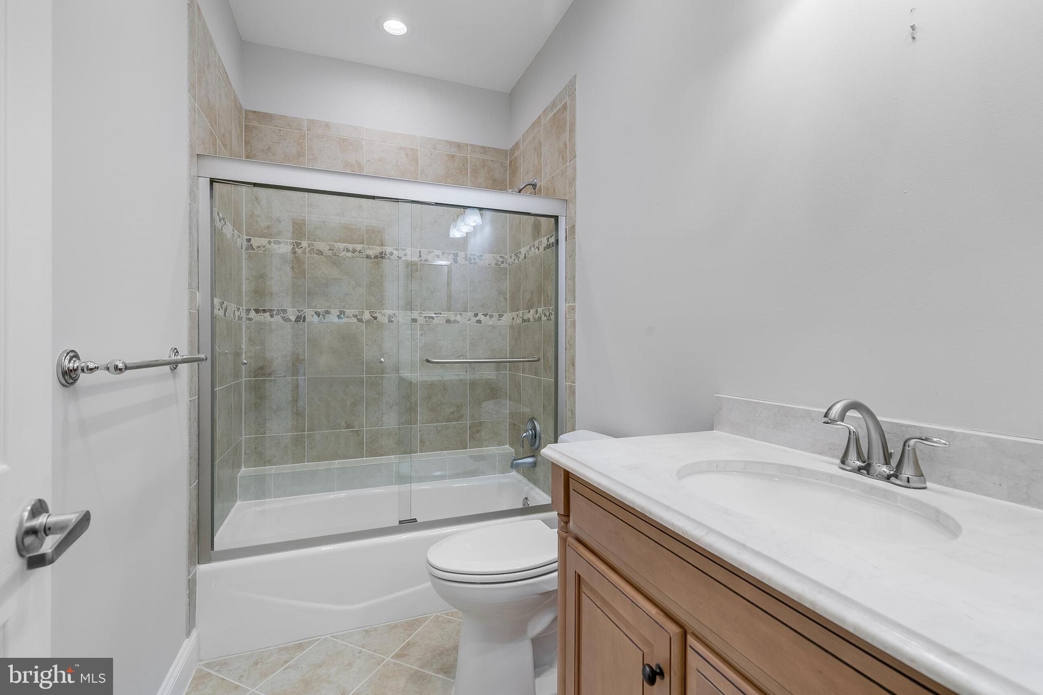 611 Catesby Court Southwest Leesburg, VA 20175 - Photo 48 of 96 a bathroom with a sink toilet and shower