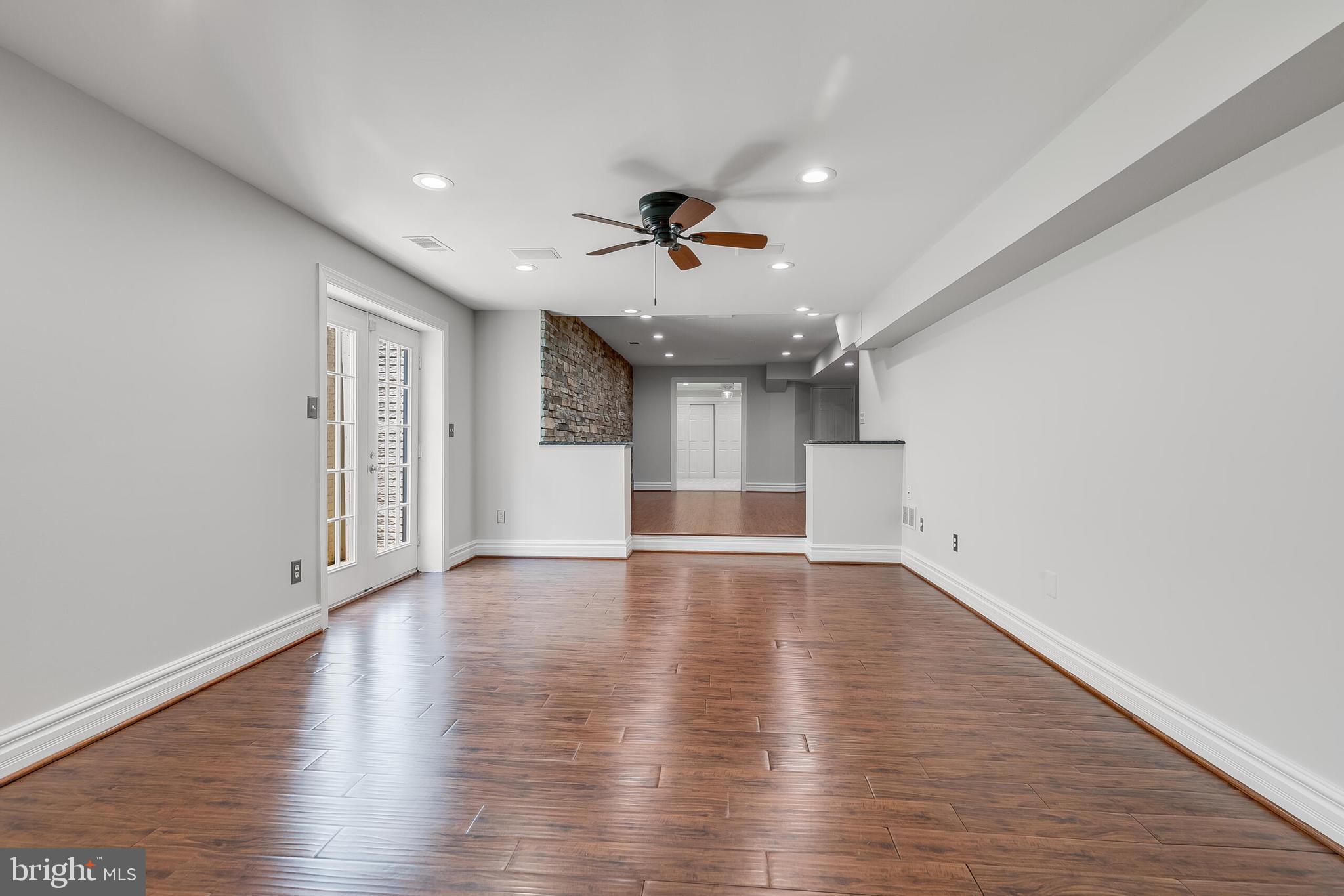 611 Catesby Court Southwest Leesburg, VA 20175 - Photo 78 of 96 wooden floor in an empty room with a window