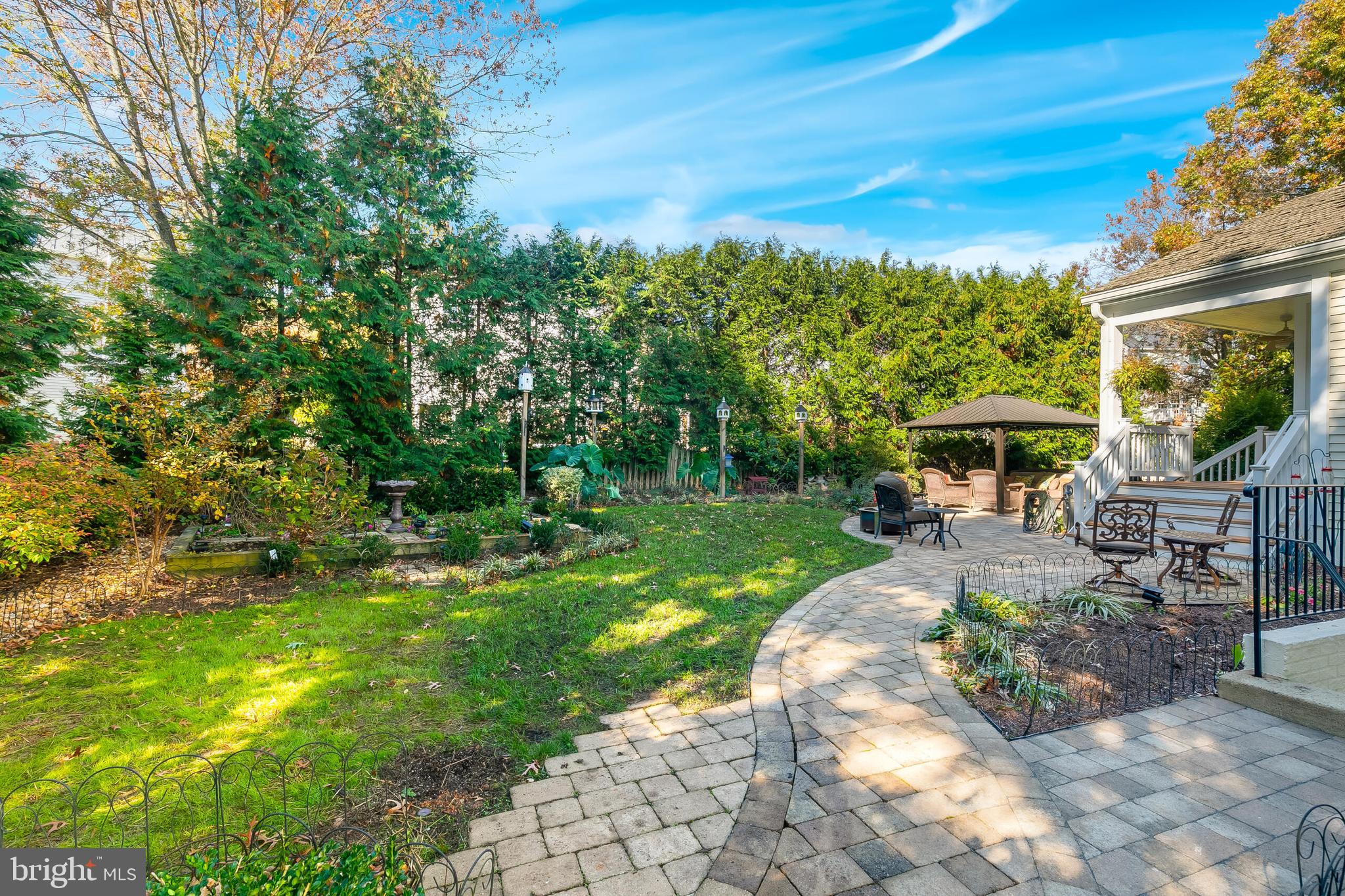 611 Catesby Court Southwest Leesburg, VA 20175 - Photo 91 of 96 a view of a patio with table and chairs under an umbrella
