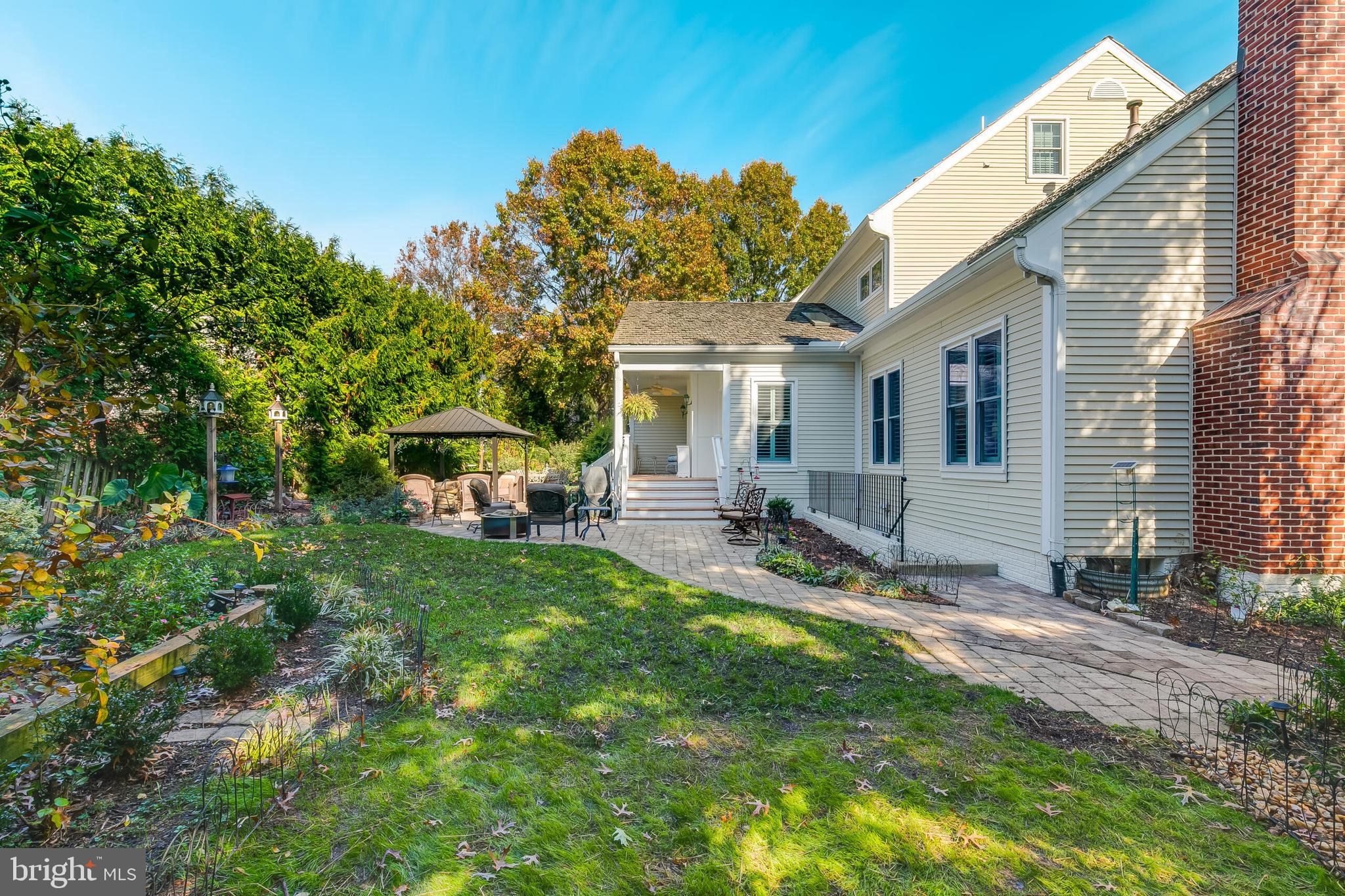 611 Catesby Court Southwest Leesburg, VA 20175 - Photo 95 of 96 a view of a house with backyard sitting area and garden