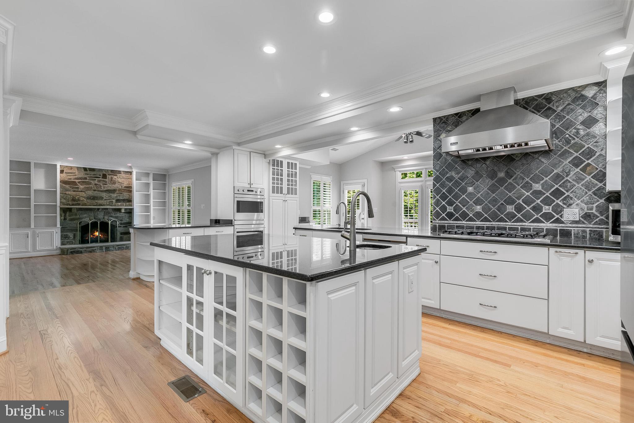 611 Catesby Court Southwest Leesburg, VA 20175 - Photo 10 of 96 a kitchen with stainless steel appliances granite countertop a stove and cabinets