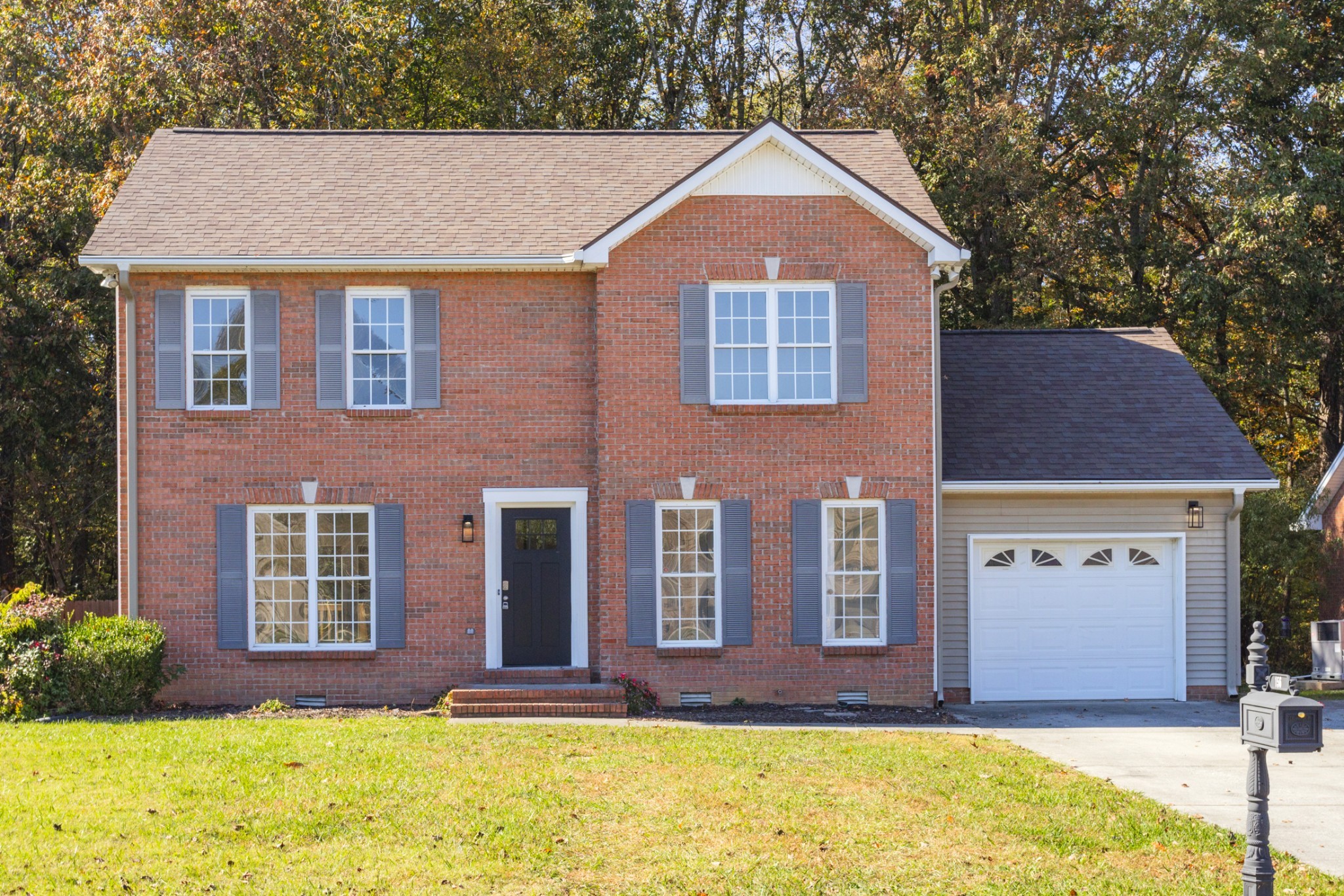 156 Foxrun Springfield, TN 37172 - Photo 1 of 33 a front view of a house with a yard