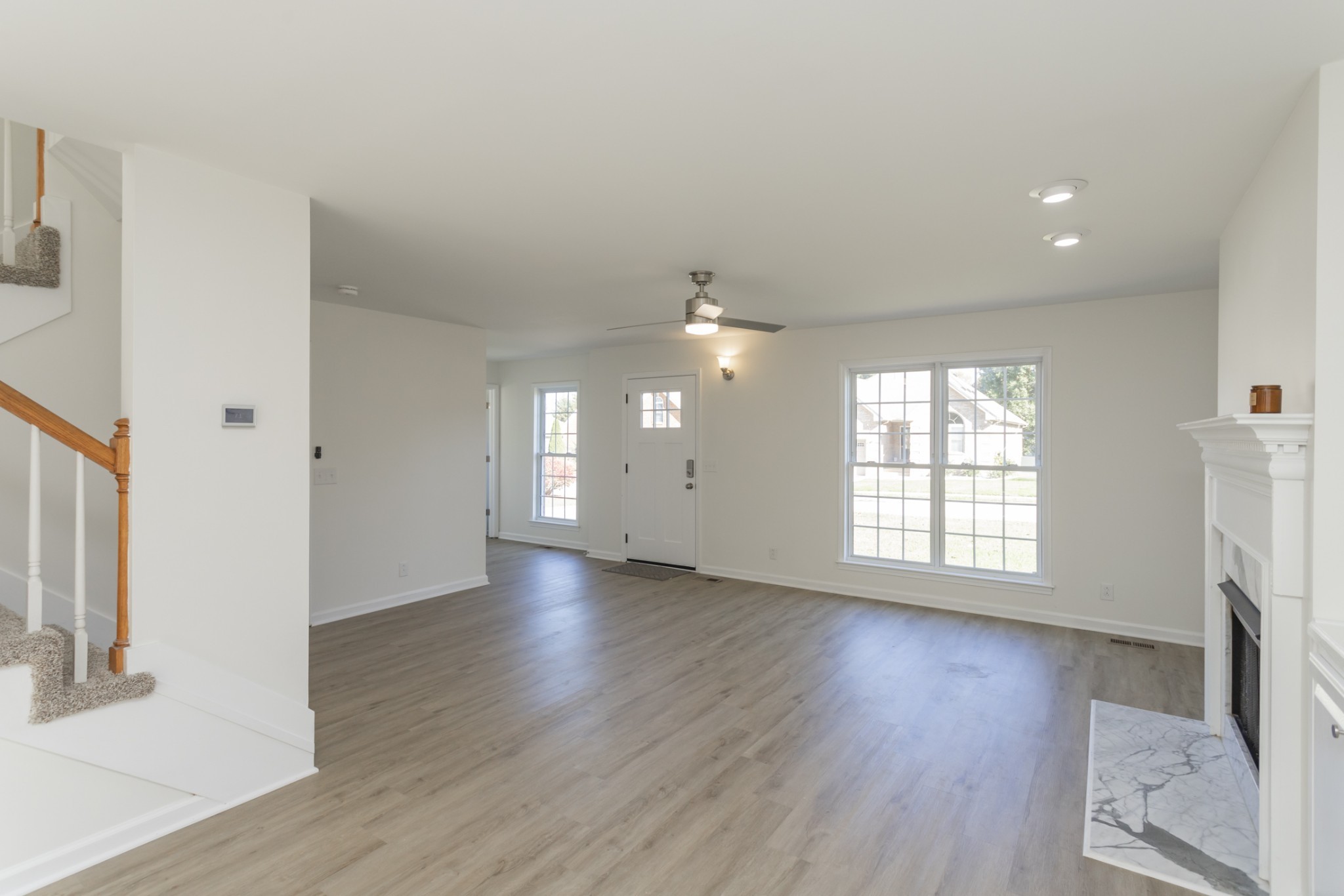 156 Foxrun Springfield, TN 37172 - Photo 10 of 33 an empty room with wooden floor and windows