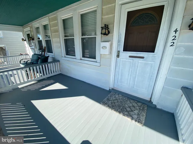 a view of a balcony with wooden floor and stairs