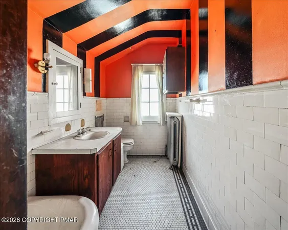 a utility room with a sink a washer and dryer