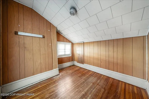 a living room with furniture and a ceiling fan