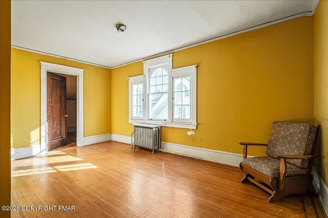 a view of a big room with wooden floor