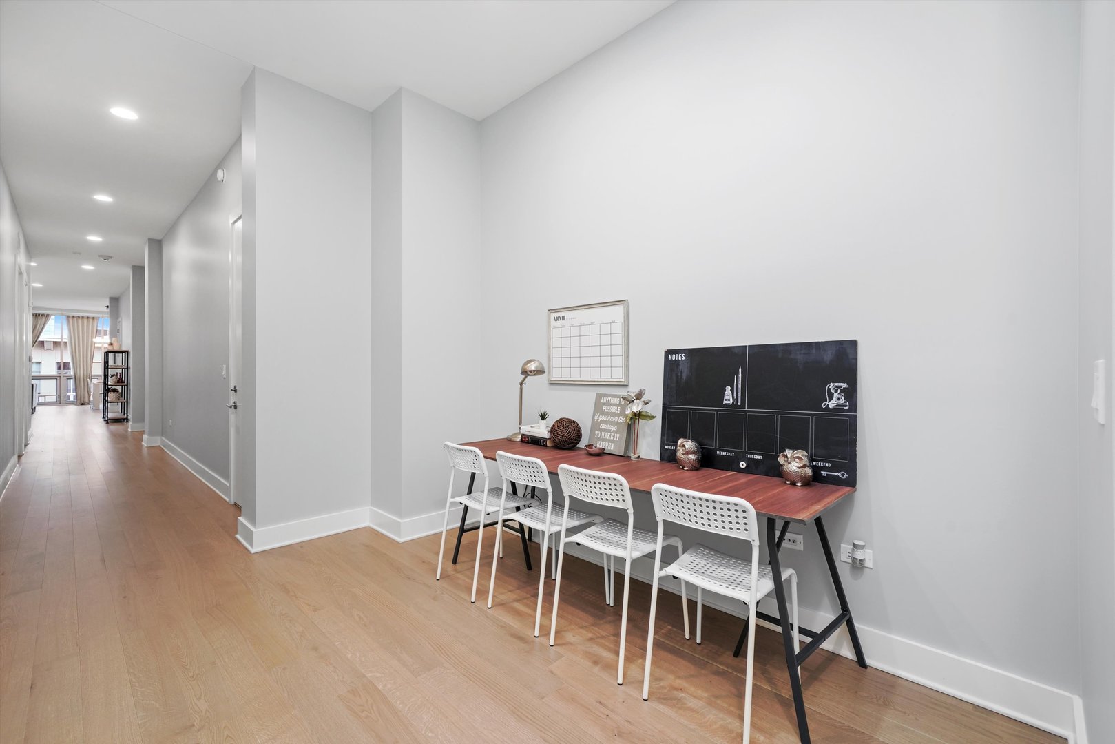 1128 West Adams Street, Unit 4E Chicago, IL 60607 - Photo 14 of 31 a dining room with furniture and wooden floor