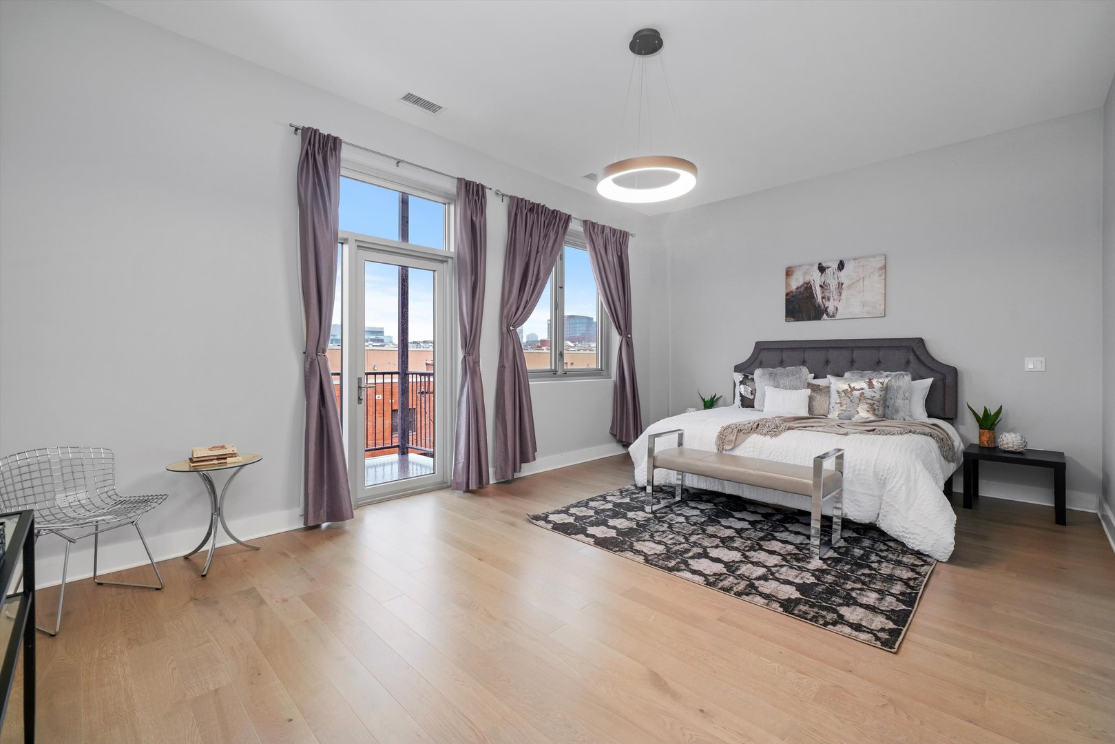 1128 West Adams Street, Unit 4E Chicago, IL 60607 - Photo 16 of 31 a bedroom with a bed and a table in it