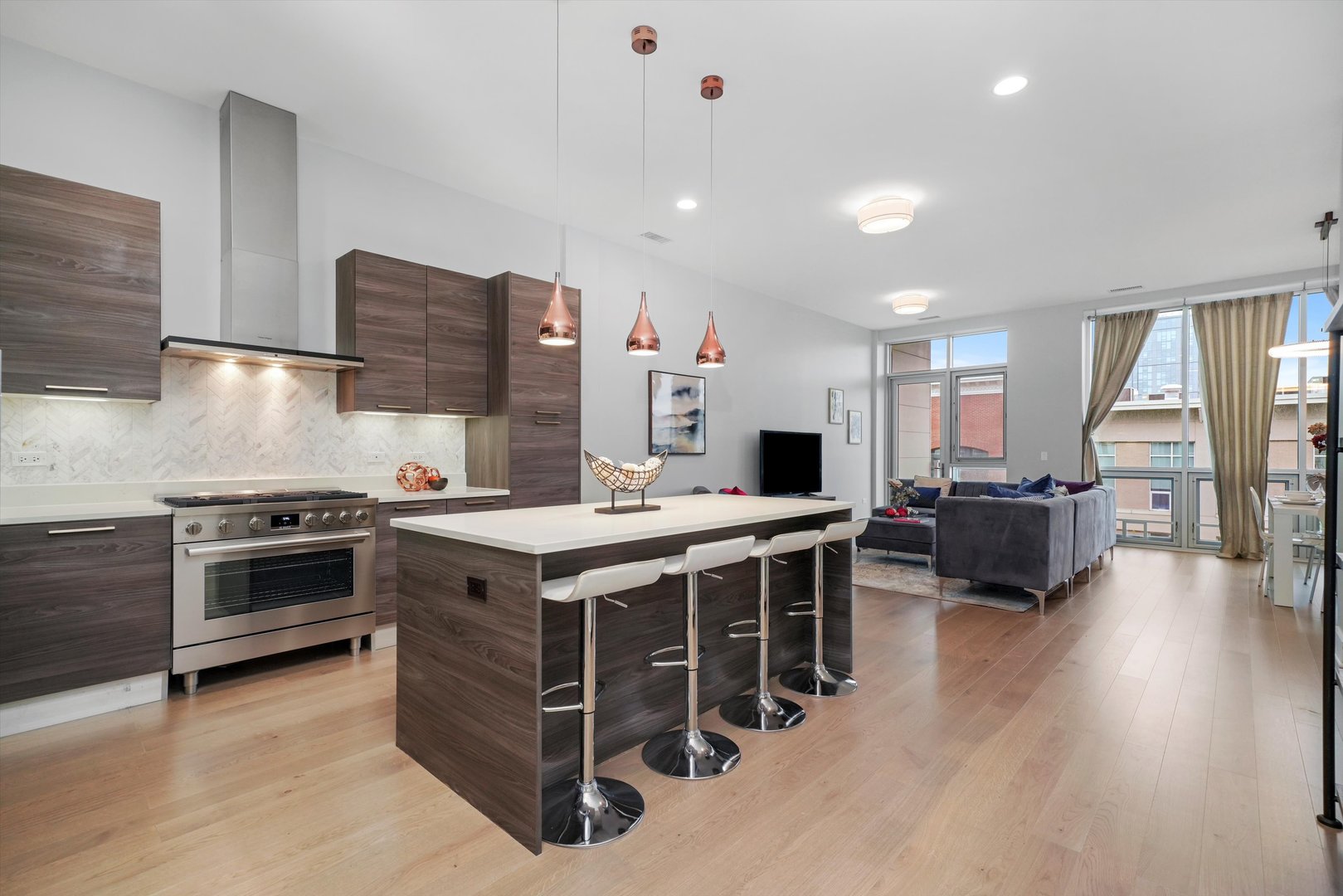 1128 West Adams Street, Unit 4E Chicago, IL 60607 - Photo 2 of 31 a kitchen with stainless steel appliances granite countertop a stove and a sink