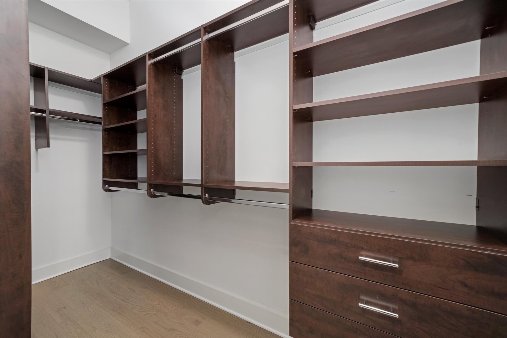 1128 West Adams Street, Unit 4E Chicago, IL 60607 - Photo 22 of 31 a view of walk in closet with empty racks