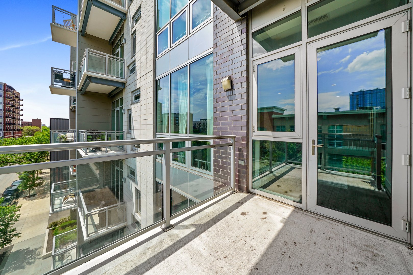 1128 West Adams Street, Unit 4E Chicago, IL 60607 - Photo 28 of 31 a view of a balcony with door