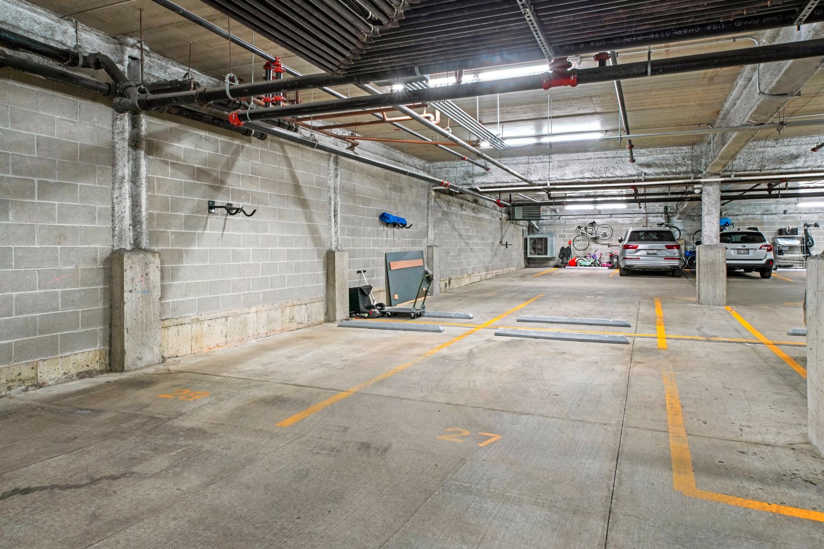 1128 West Adams Street, Unit 4E Chicago, IL 60607 - Photo 30 of 31 a view of parking garage with cars
