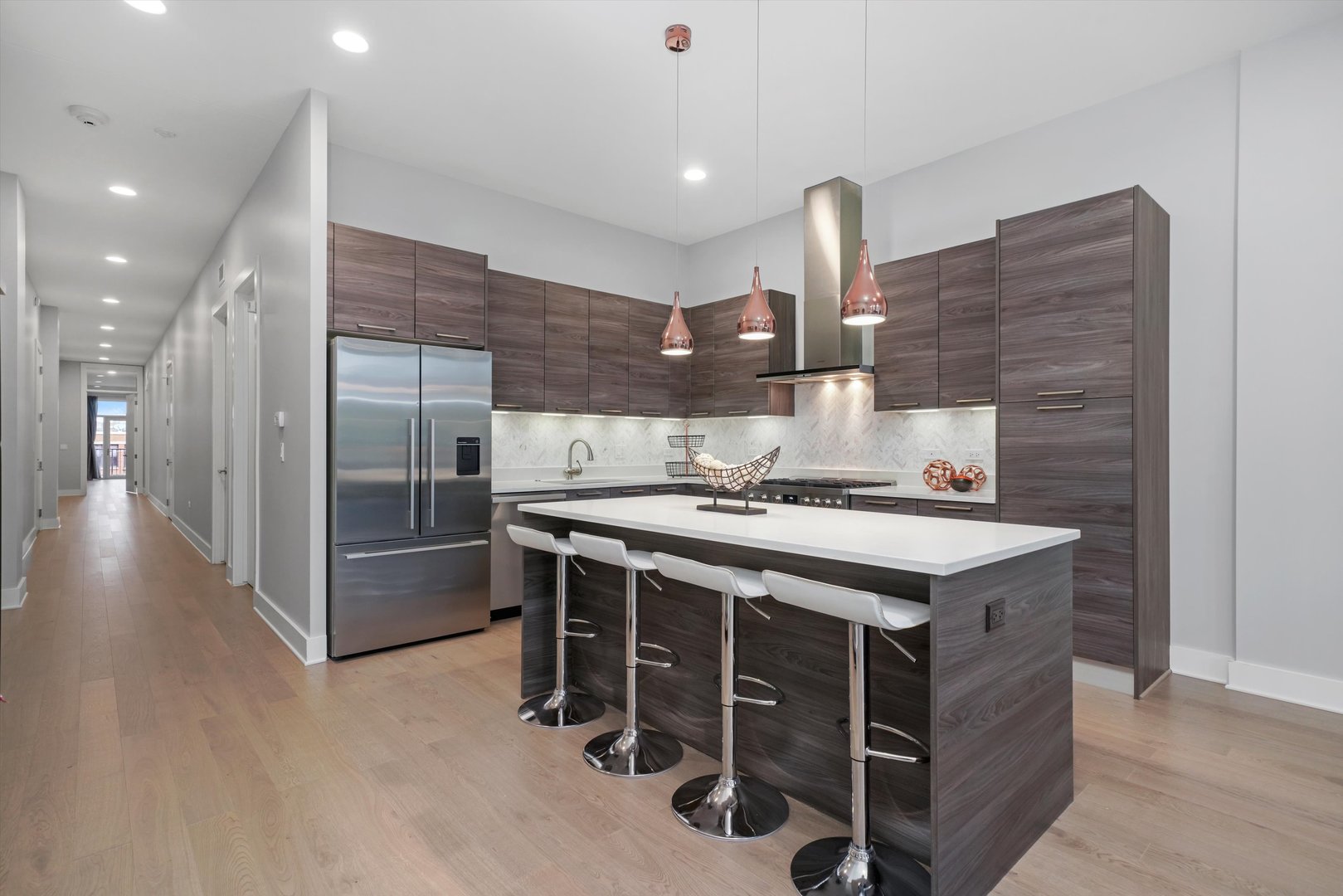 1128 West Adams Street, Unit 4E Chicago, IL 60607 - Photo 3 of 31 a kitchen with stainless steel appliances a sink stove and refrigerator
