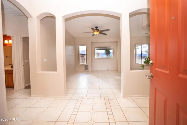 a kitchen with stainless steel appliances granite countertop a refrigerator sink and stove