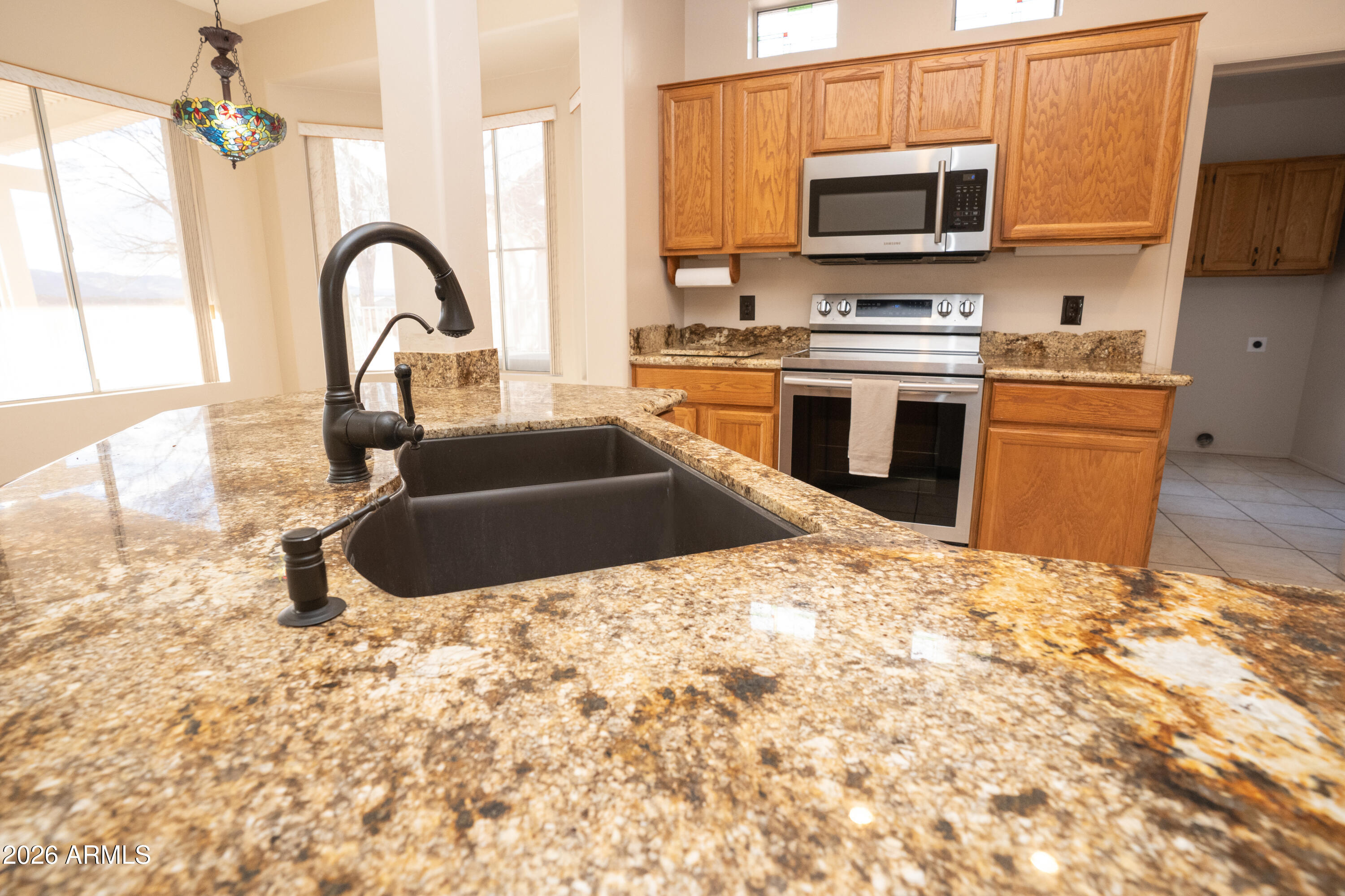 5320 Painted Desert Road Cornville, AZ 86325 - Photo 16 of 58 a kitchen with stainless steel appliances a stove a sink and a microwave