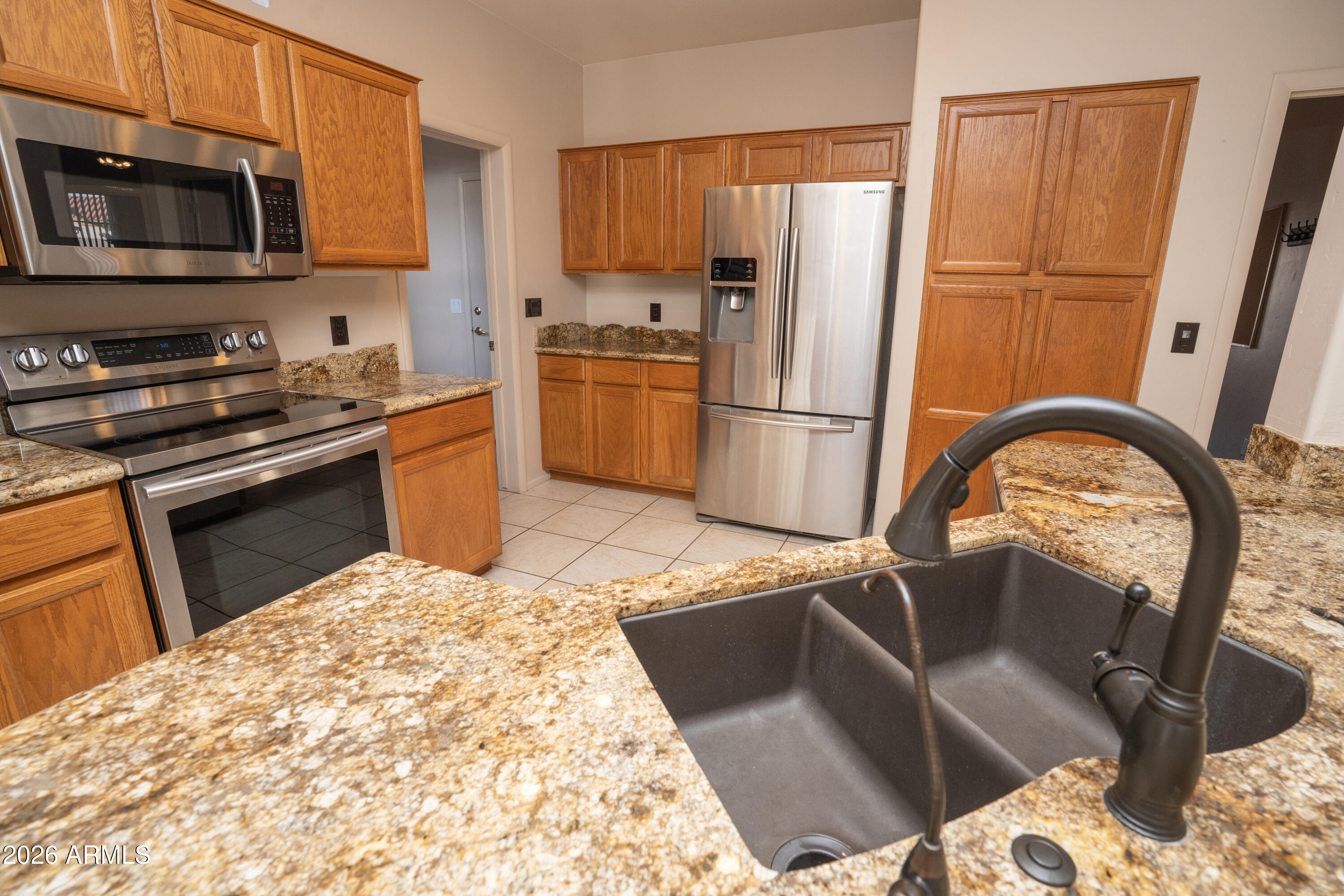 5320 Painted Desert Road Cornville, AZ 86325 - Photo 18 of 58 a kitchen with stainless steel appliances granite countertop a refrigerator sink and stove