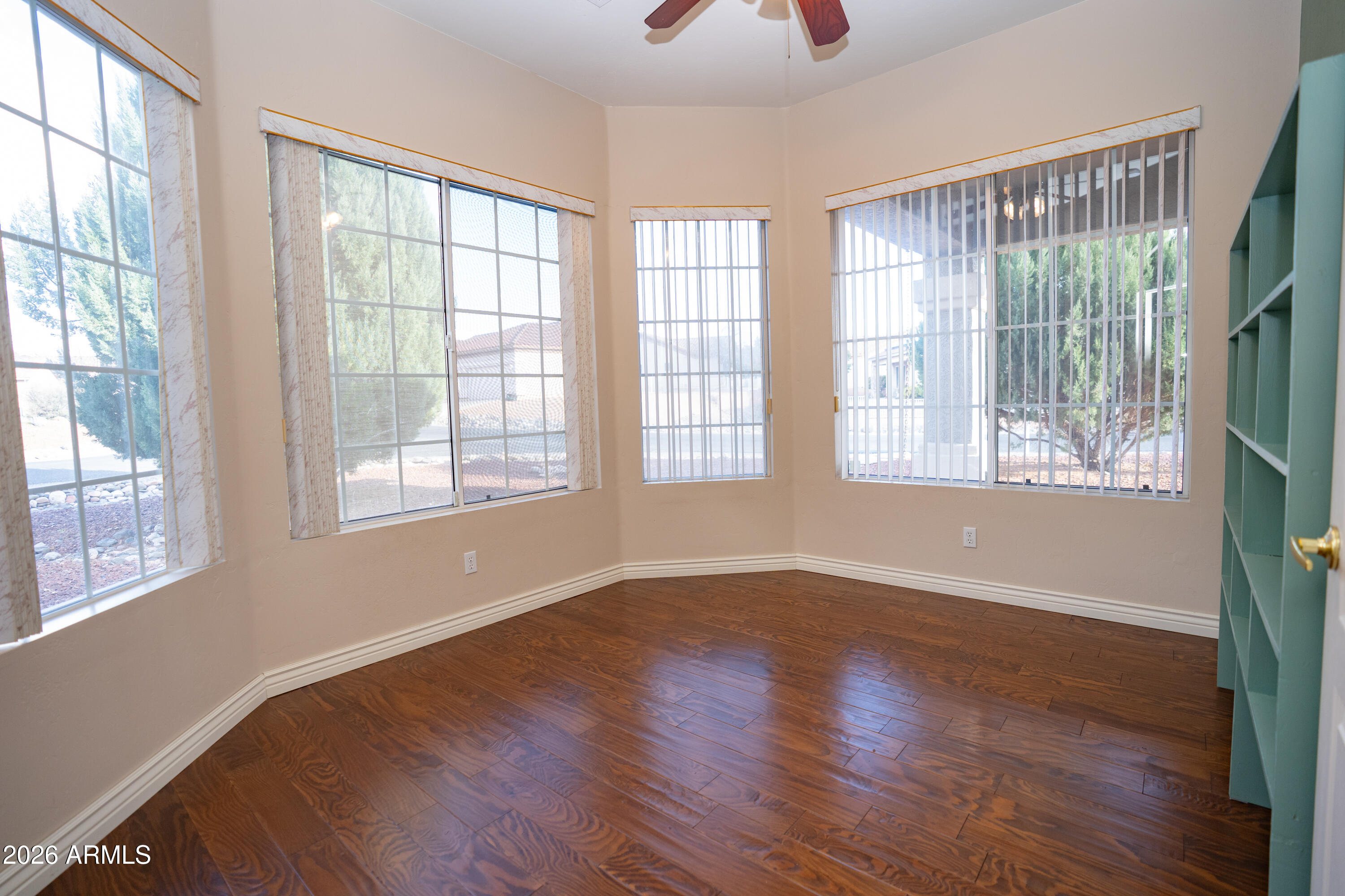 5320 Painted Desert Road Cornville, AZ 86325 - Photo 23 of 58 a view of an empty room with wooden floor and a window