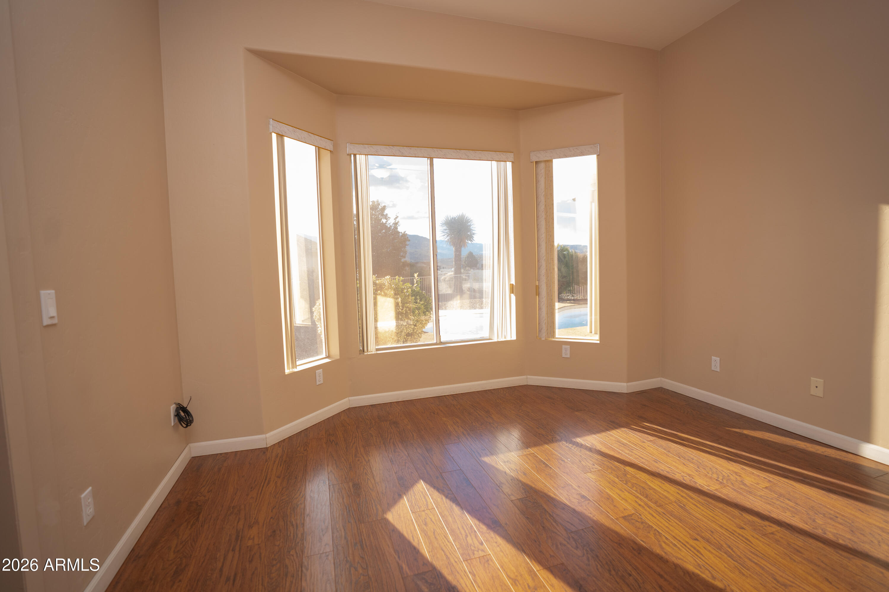 5320 Painted Desert Road Cornville, AZ 86325 - Photo 28 of 58 a view of an empty room with wooden floor and a window