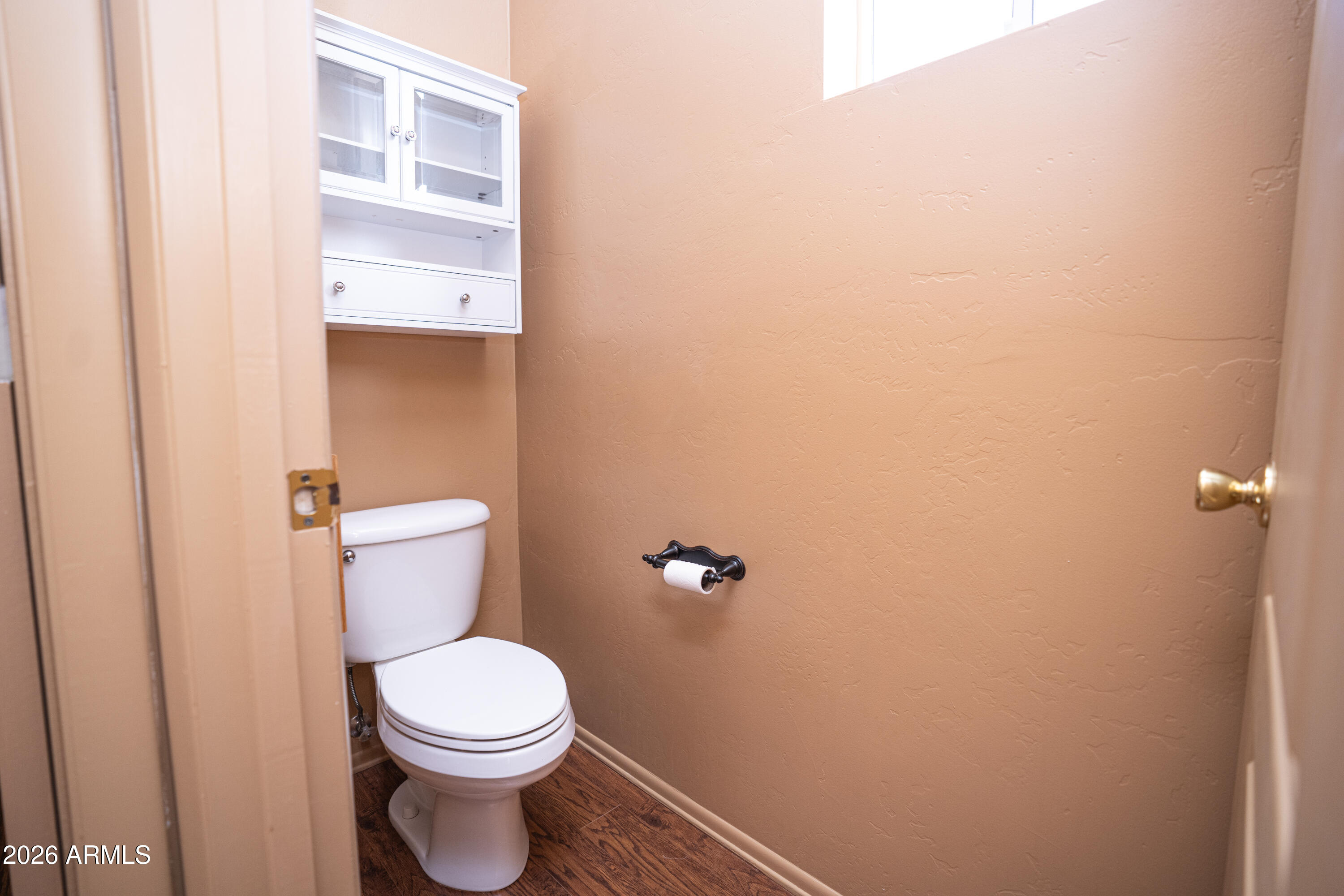 5320 Painted Desert Road Cornville, AZ 86325 - Photo 33 of 58 a white toilet sitting next to a white cabinet