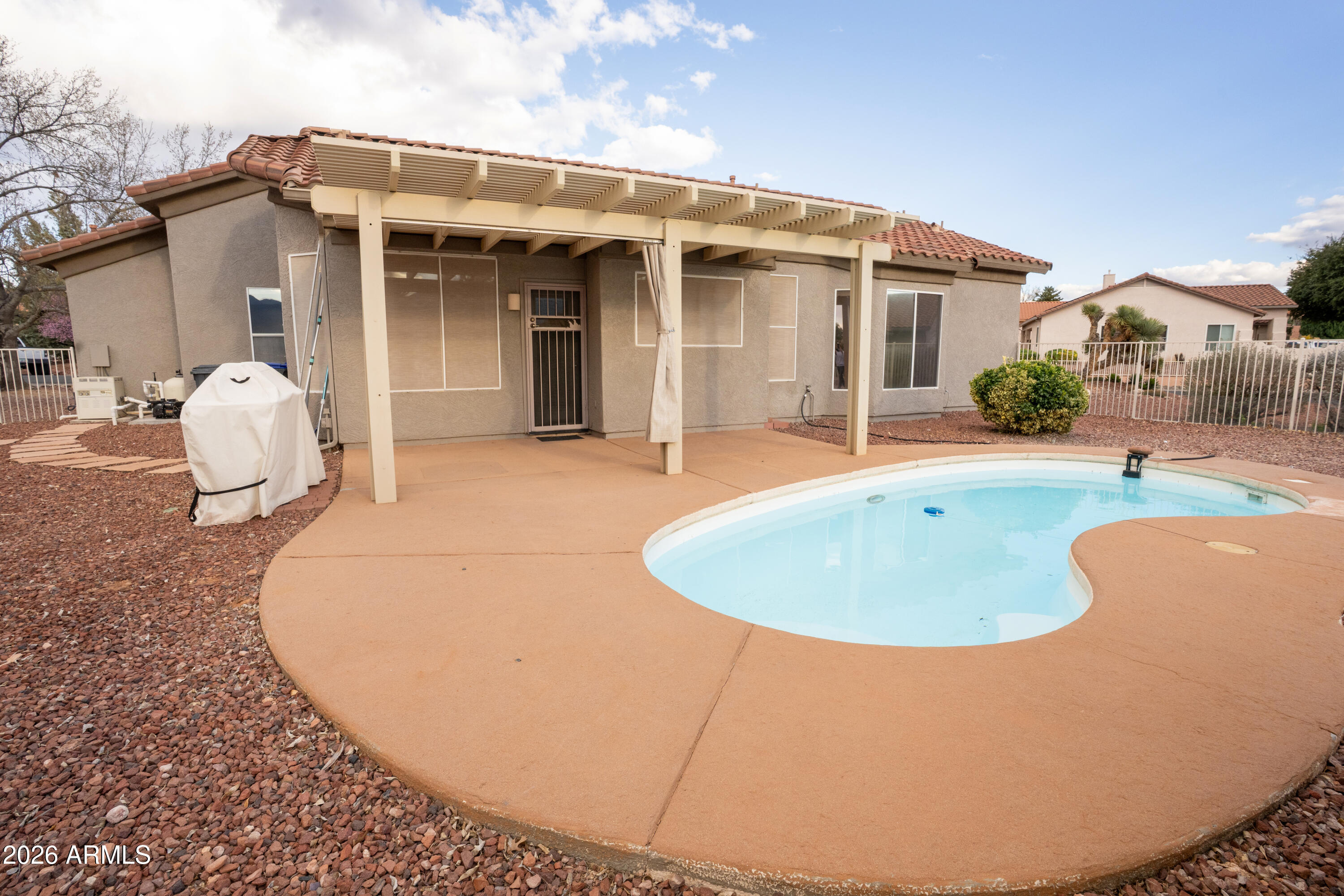5320 Painted Desert Road Cornville, AZ 86325 - Photo 48 of 58 a view of a house with a swimming pool and a yard