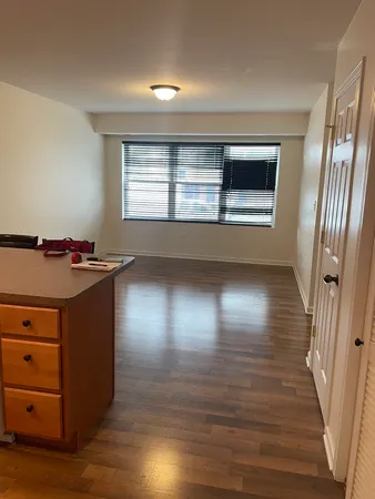 a kitchen with a refrigerator and window