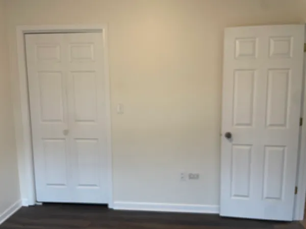 an empty room with wooden floor