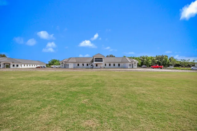a front view of a house with a swimming pool