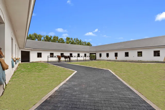 a swimming pool with outdoor seating and yard