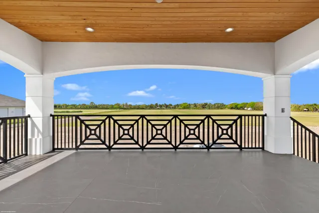 a spacious bedroom with a bed and a couch