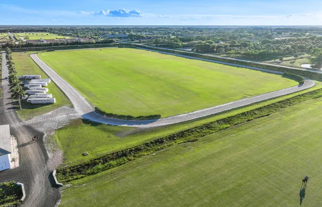 a view of a swimming pool and an outdoor seating