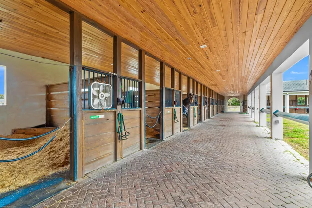 a view of a house with a yard and garage