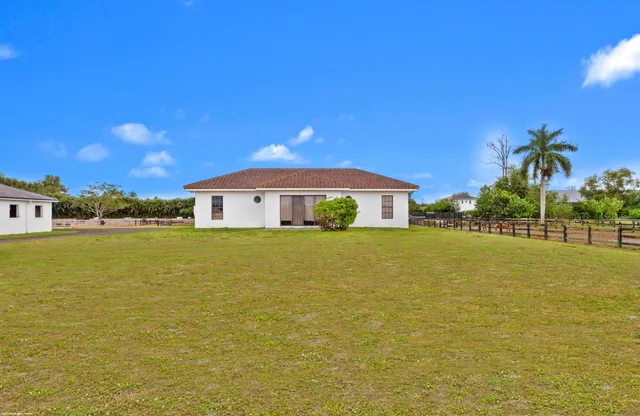 a view of swimming pool with seating space