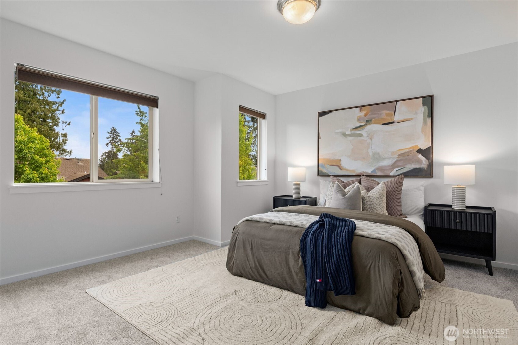 16516 2nd Park Southeast Bothell, WA 98012 - Photo 20 of 39 a bedroom with a bed and a painting on the wall