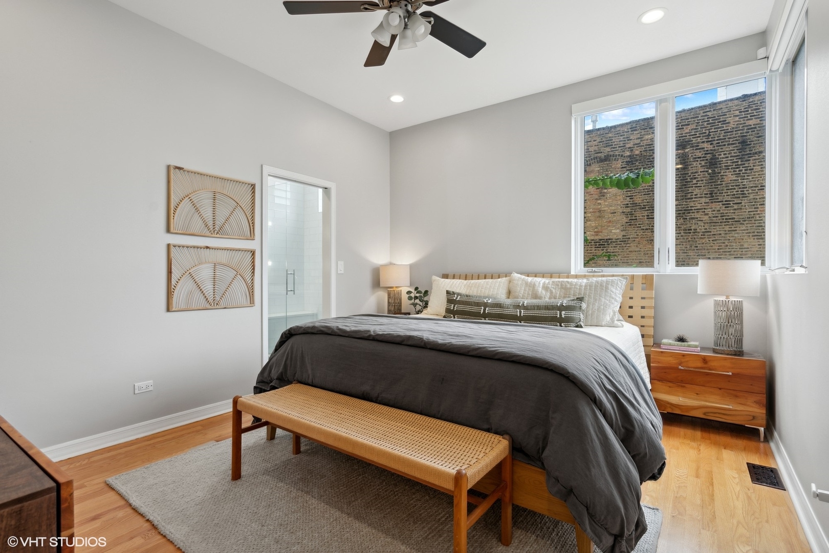 958 North Wood Street, Unit A Chicago, IL 60622 - Photo 11 of 17 a bedroom with a bed and a chandelier