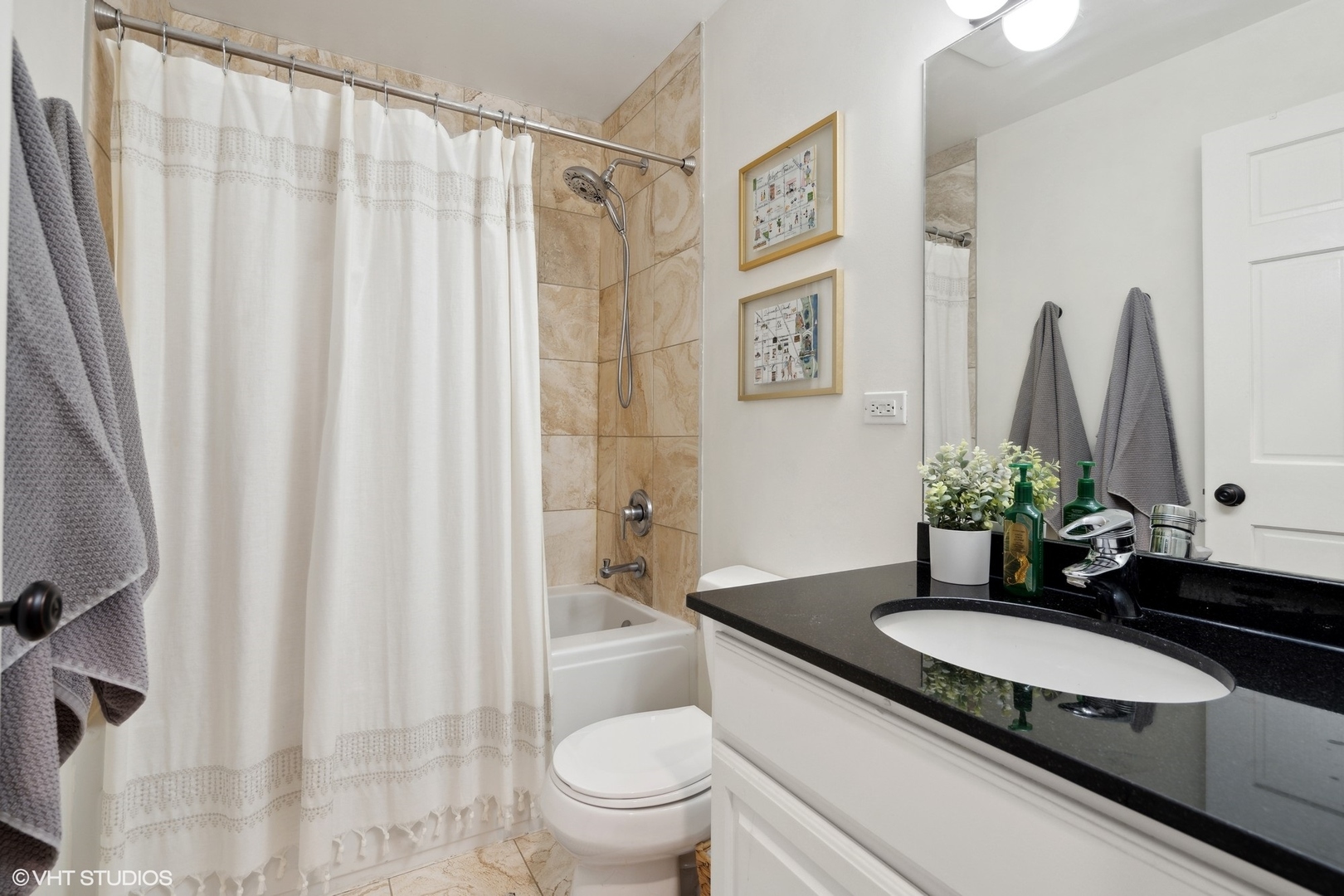 958 North Wood Street, Unit A Chicago, IL 60622 - Photo 15 of 17 a bathroom with a granite countertop sink and a mirror